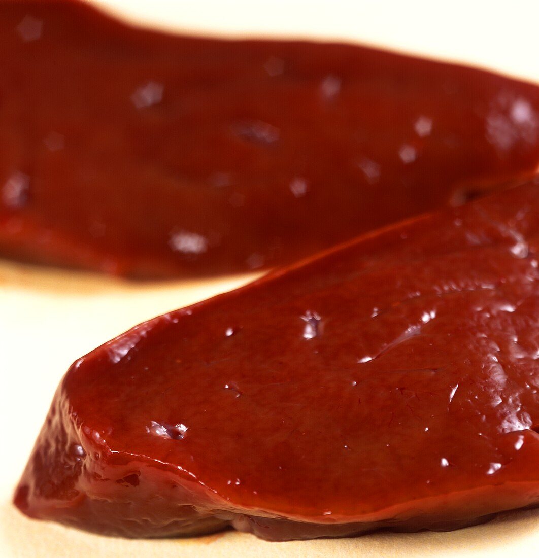 Two slices of raw liver
