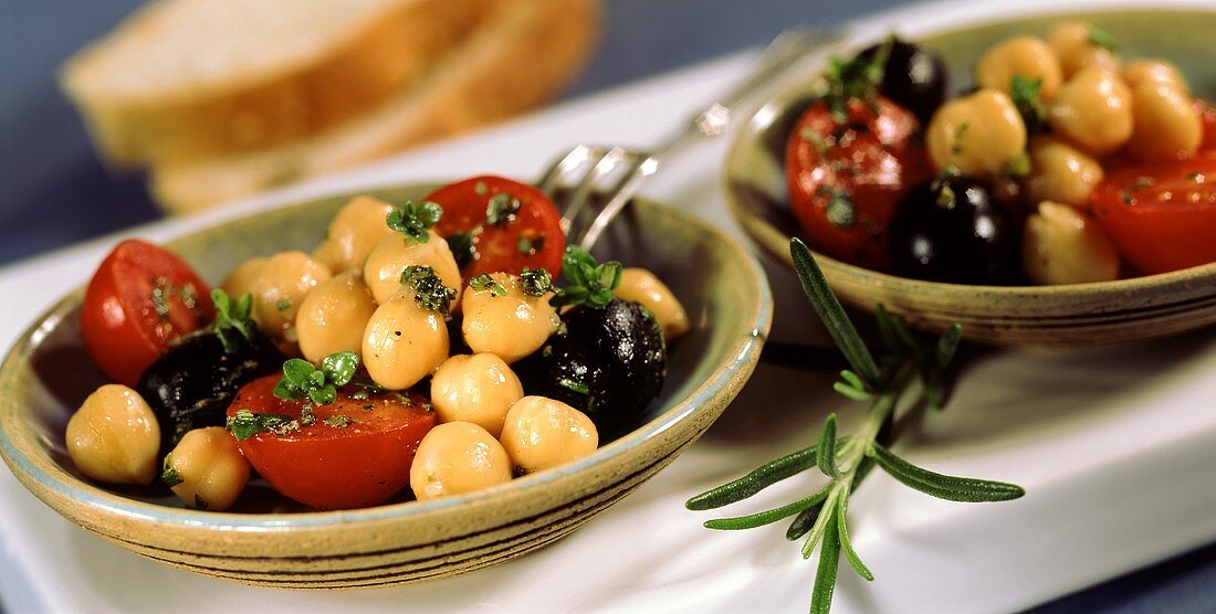 Chick-pea salad with cherry tomatoes, olives and herbs