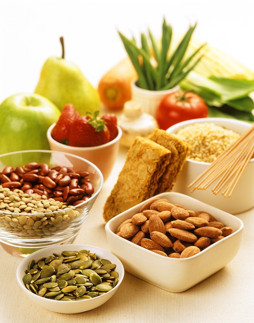 Various nuts, vegetables, muesli bars and fruit