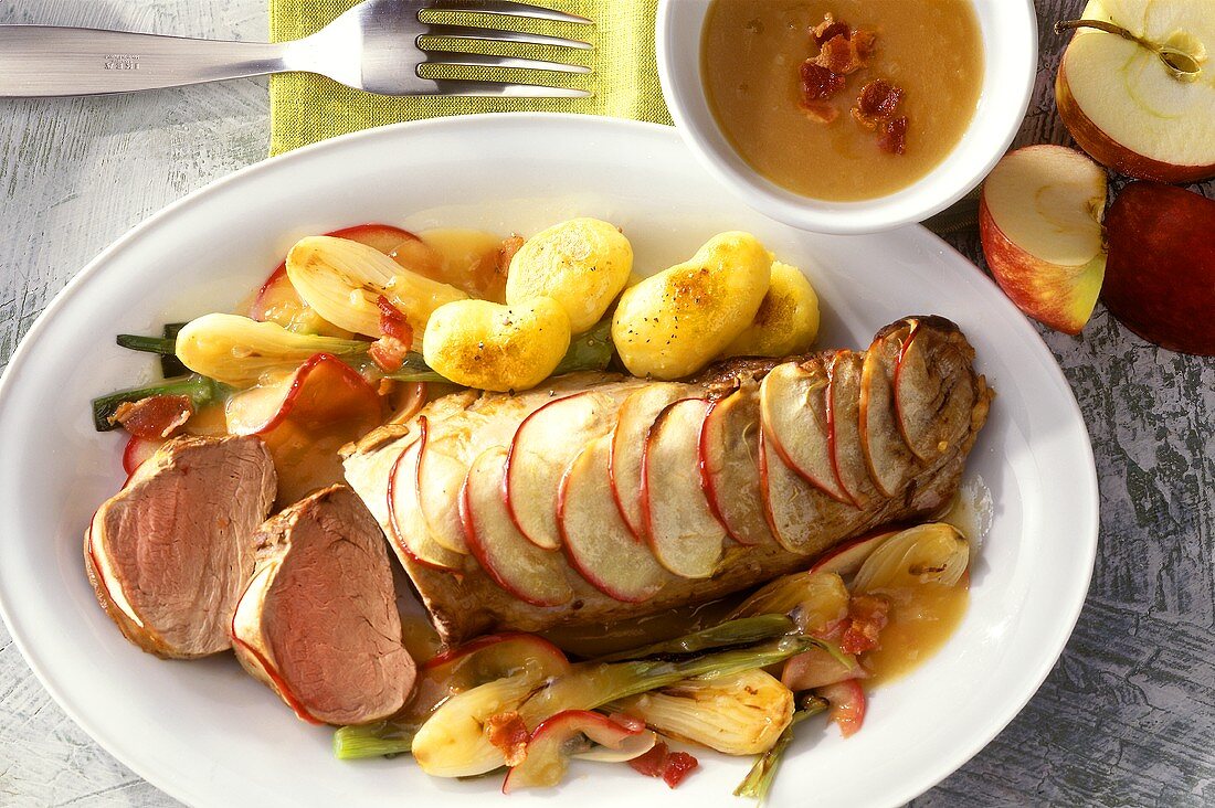 Pork fillet in apple coating with vegetables and potatoes