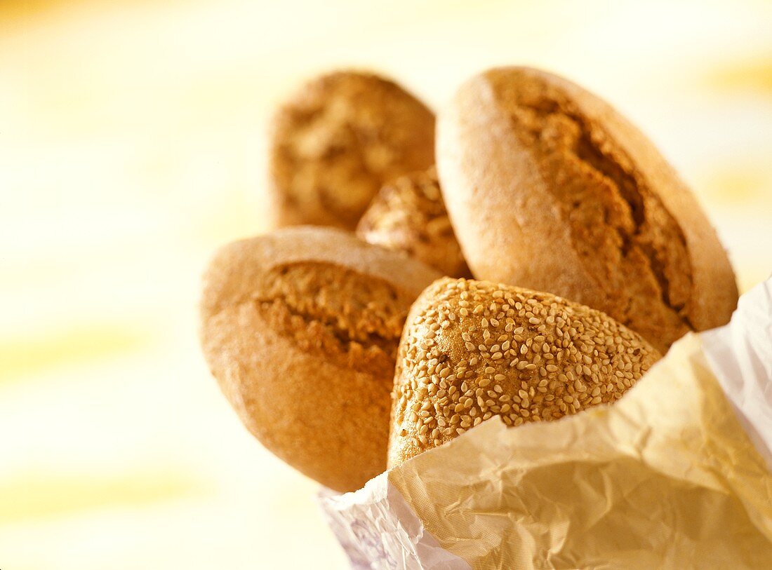 Assorted wholemeal rolls in paper bag
