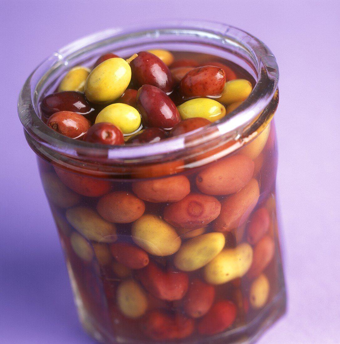 Pickled green and black olives in jar