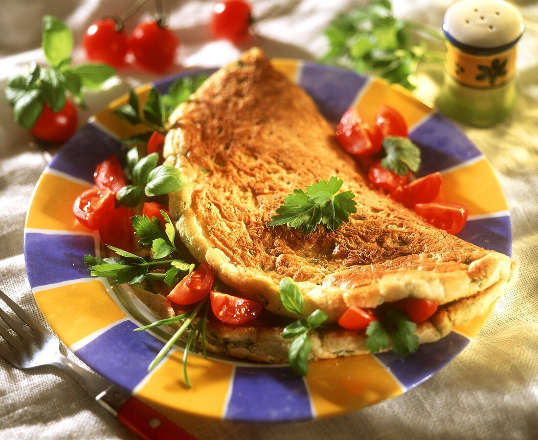 Omelette with herbs and tomatoes