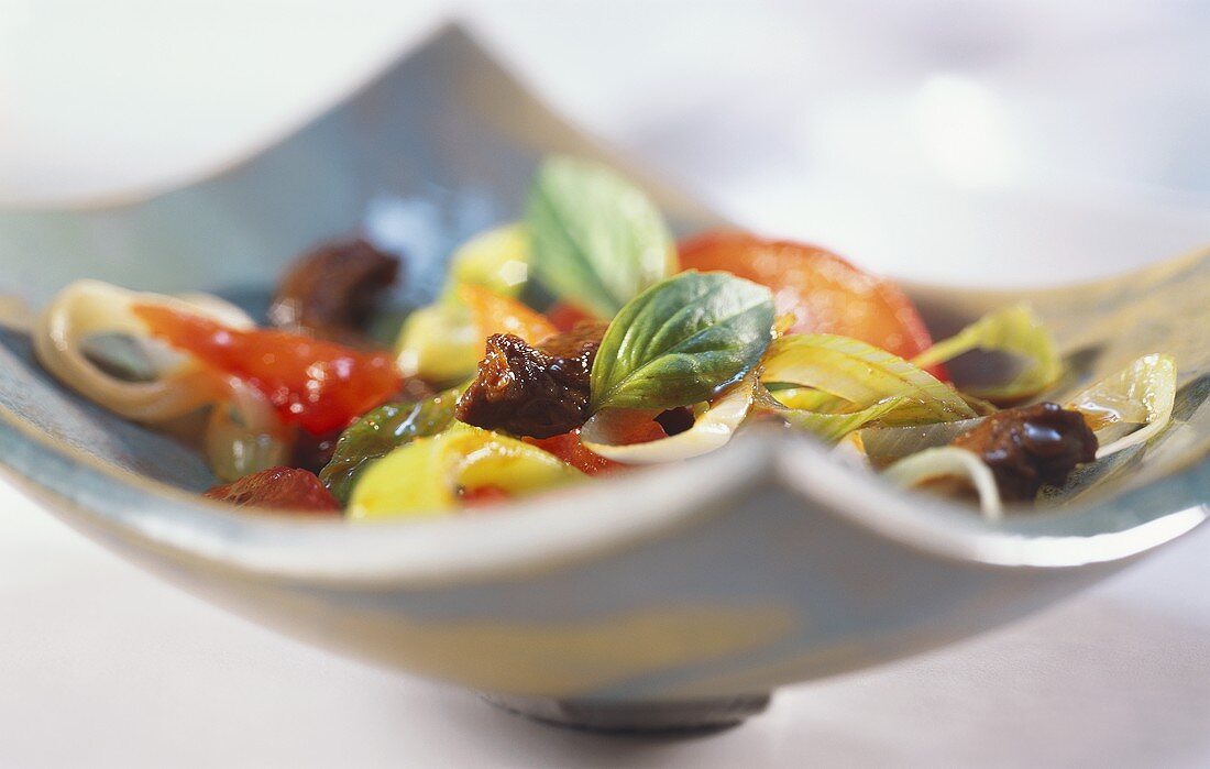 Beef fillet with vegetables and fresh basil