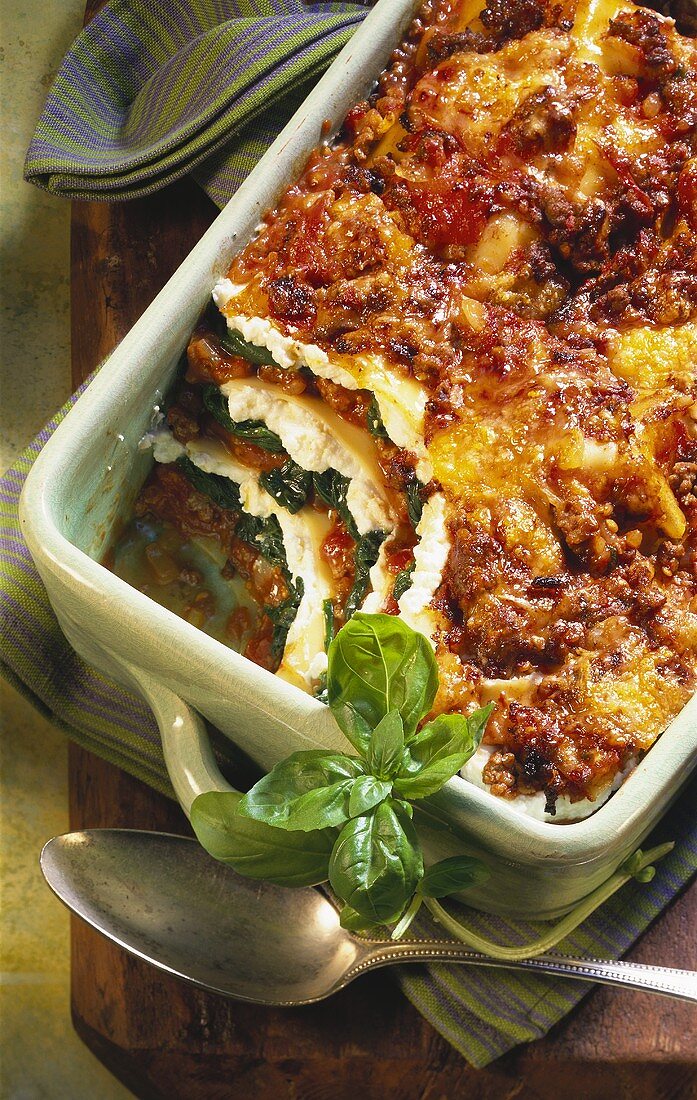 Spinach lasagne with mince in baking dish