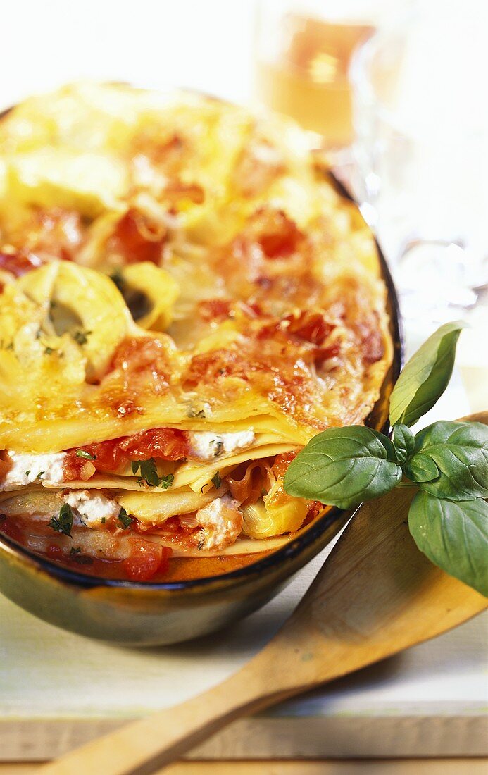 Artichoke lasagne with tomatoes and ham
