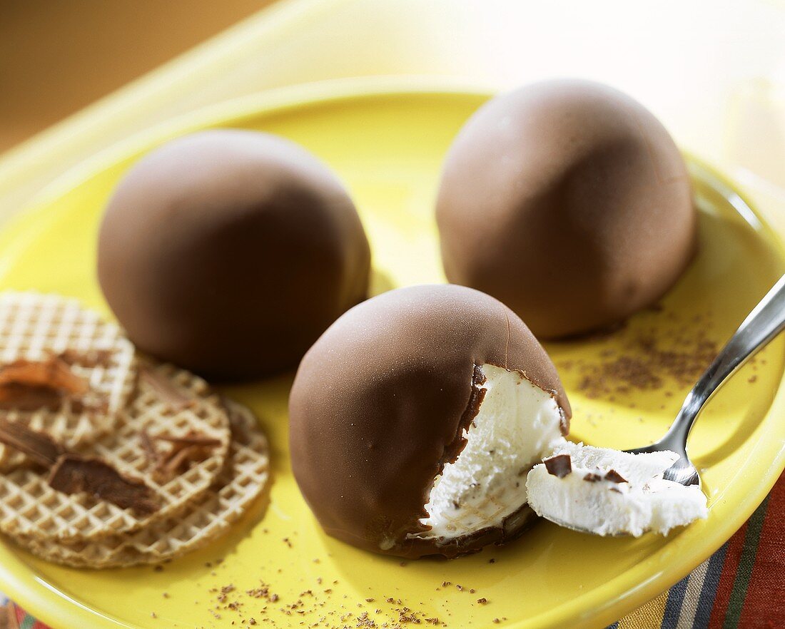 Ice cream chocolate marshmallows on yellow plate