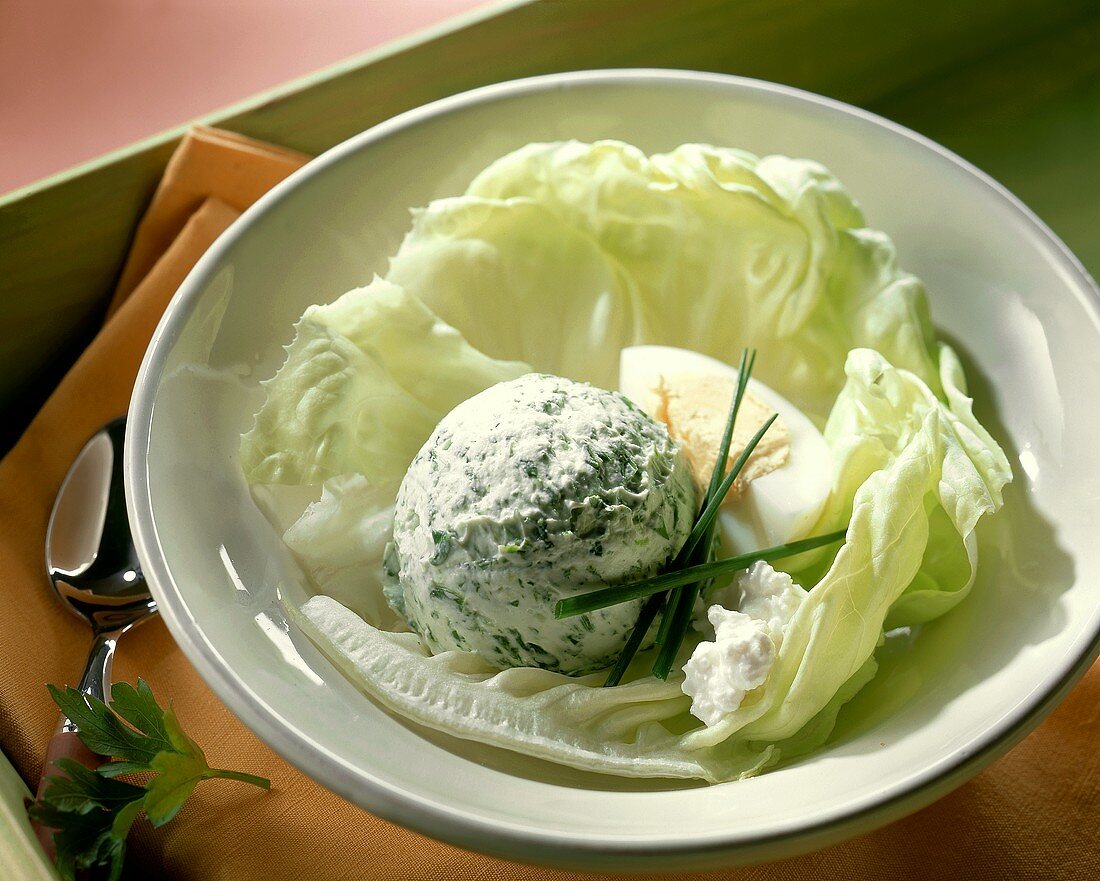 Spinach ice cream with boiled egg on lettuce