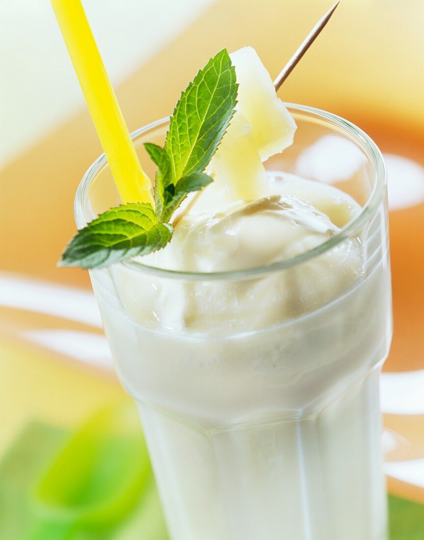Pineapple milk with ice cream and lemon balm