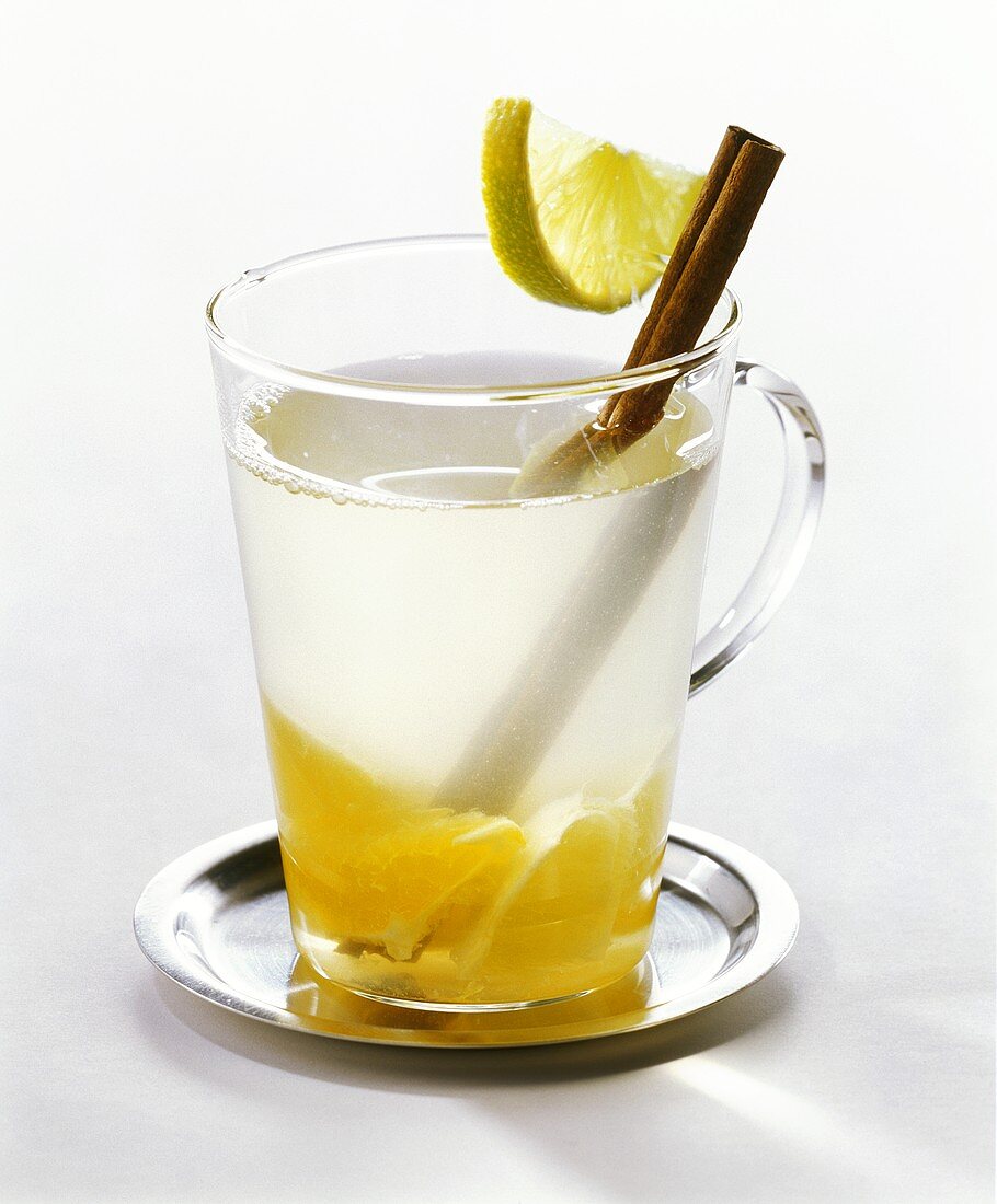 Citrus punch with cinnamon stick in glass