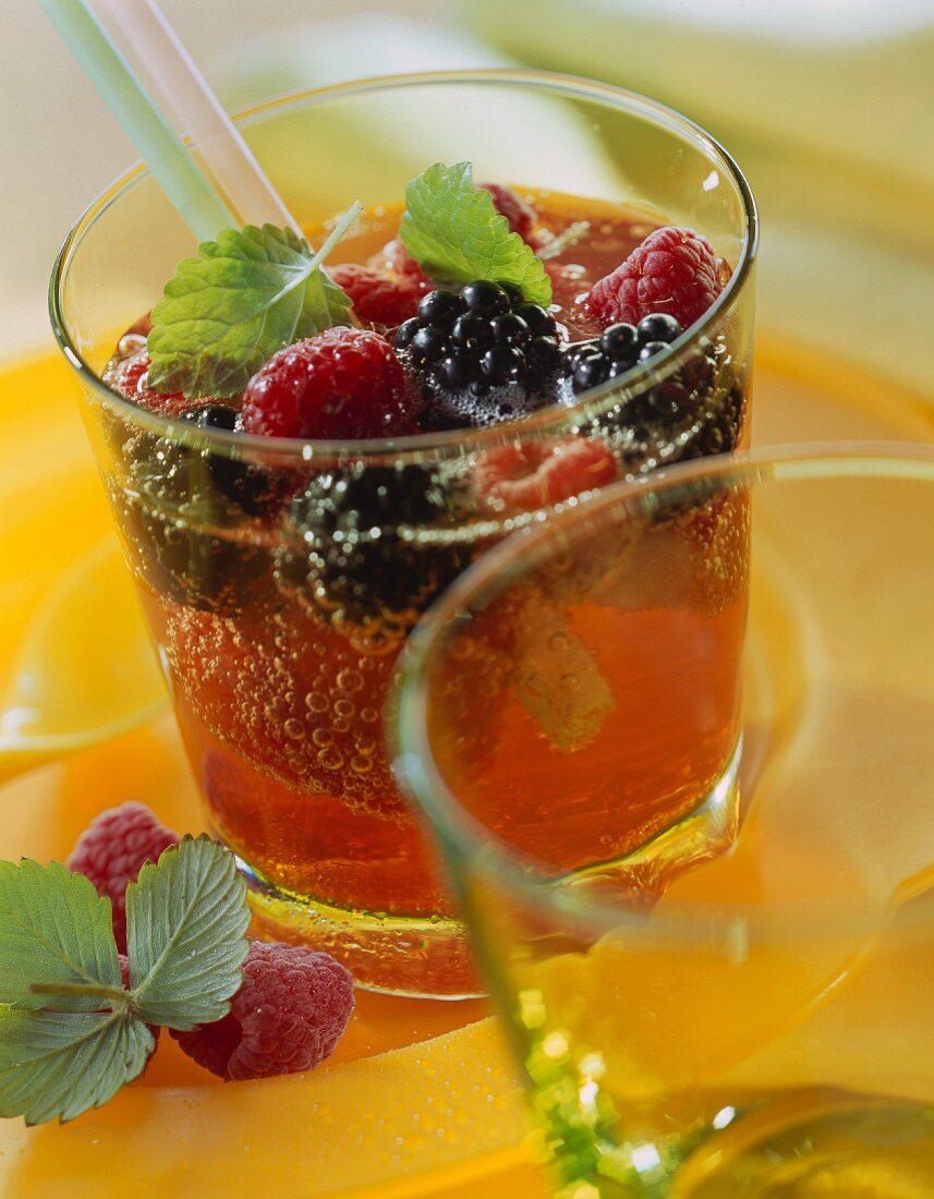 Summer punch with berries and lemon balm