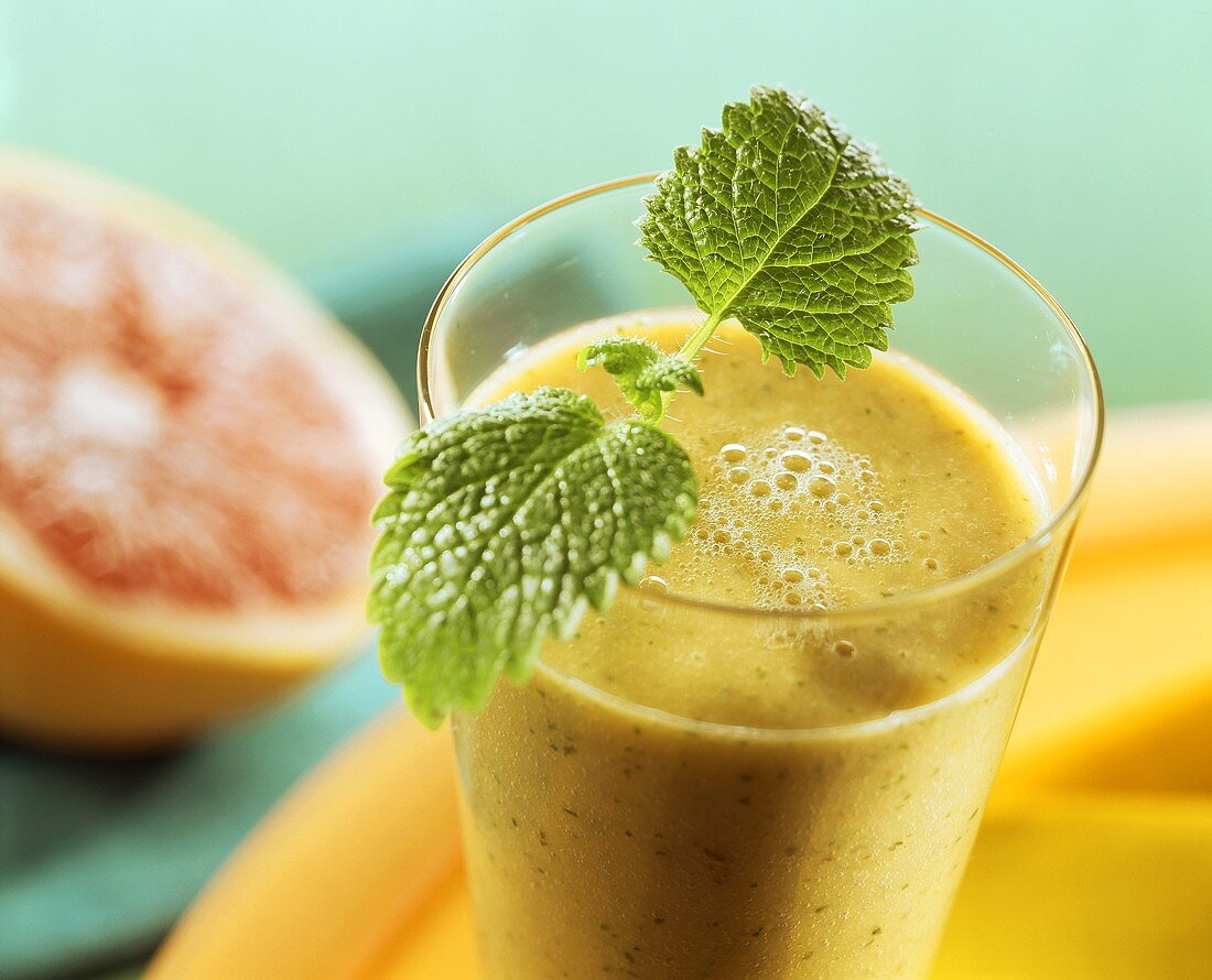 Grapefruit and lemon balm drink with fresh lemon balm