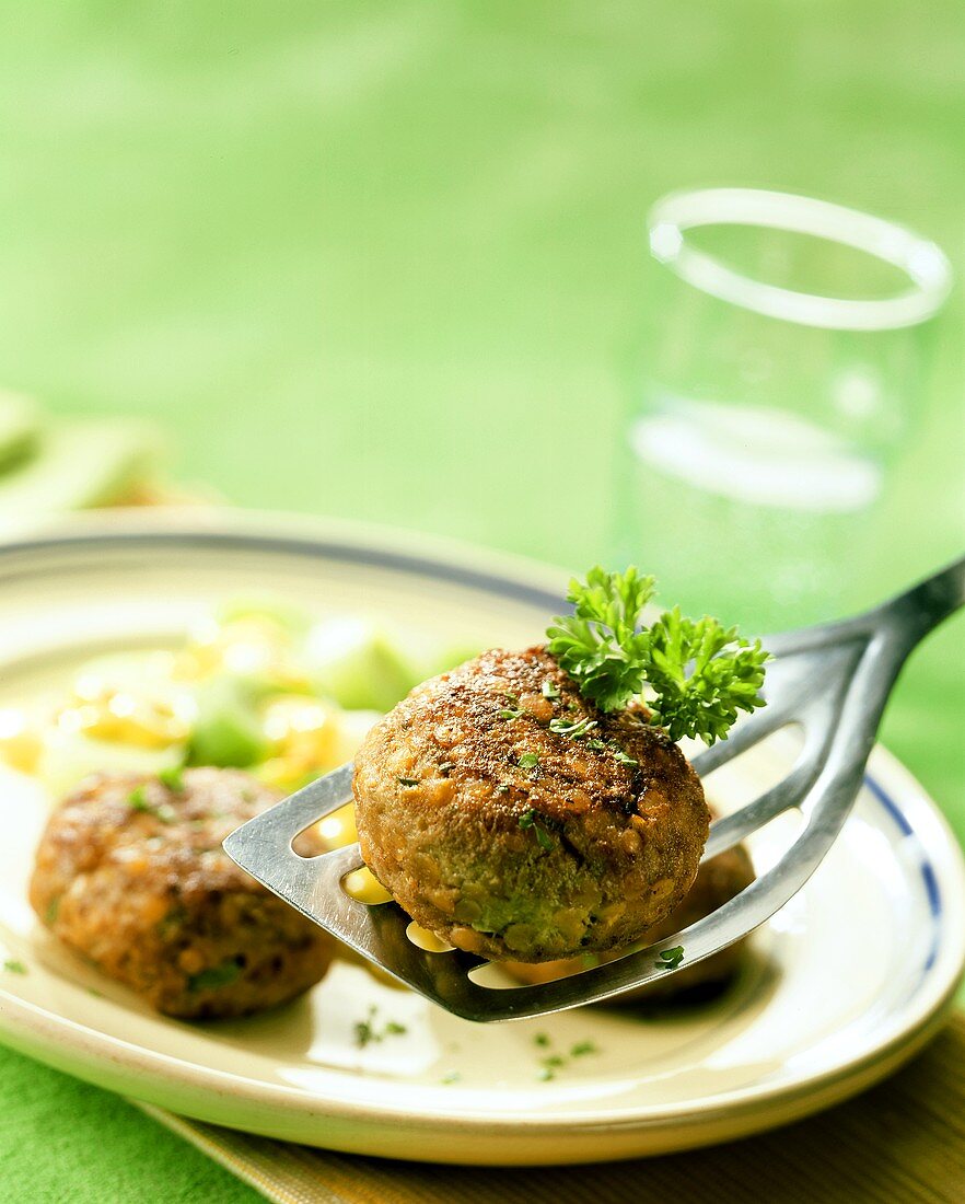 Rissole with sweetcorn and parsley on server