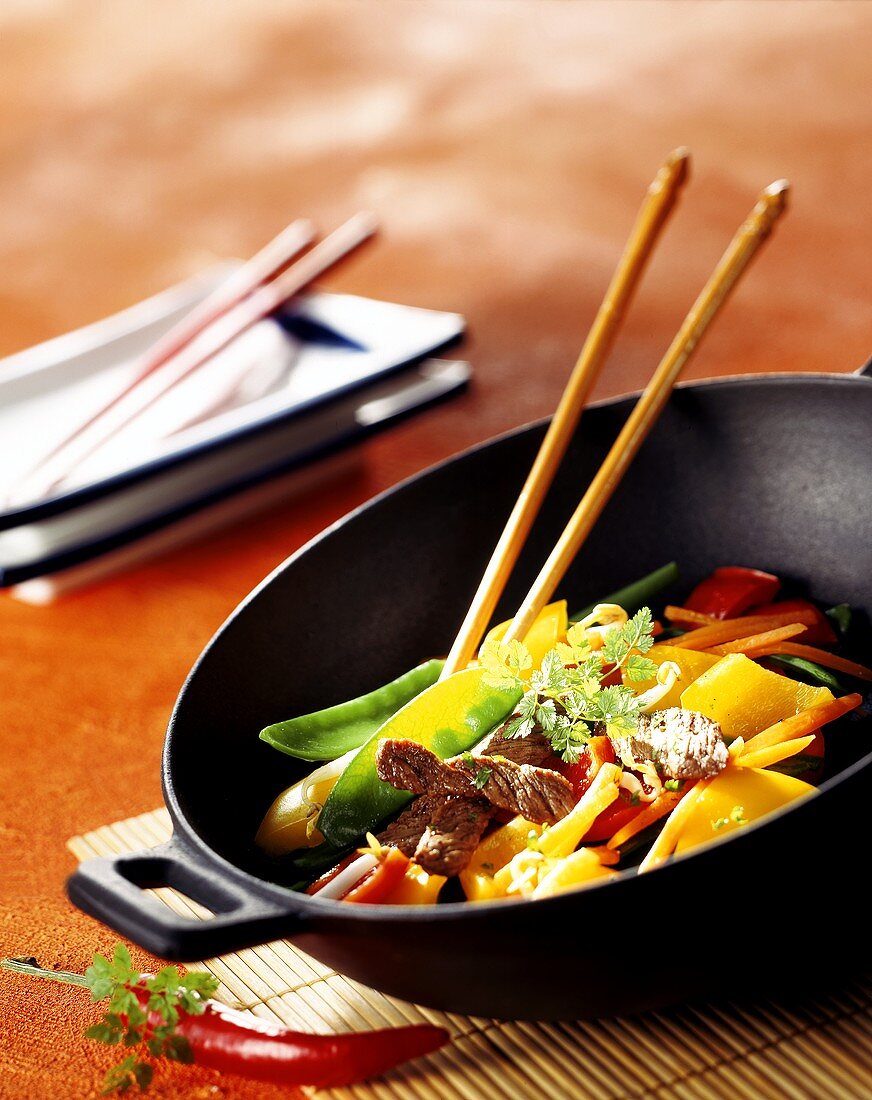 Beef and vegetables in wok