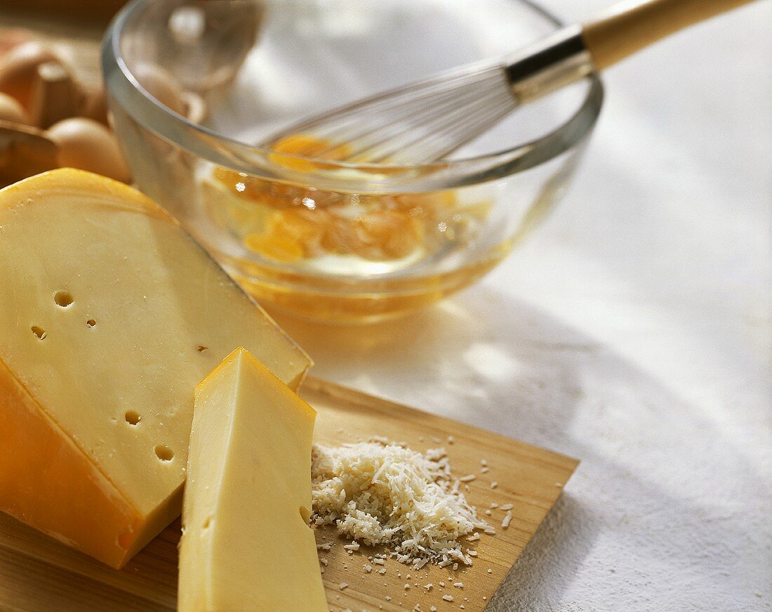 Gouda, partly grated, and broken eggs