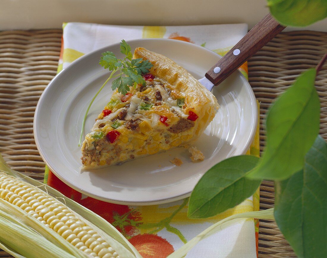 Piece of sweetcorn quiche with mince
