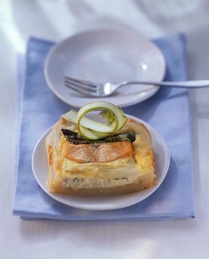 Salmon & asparagus quiche, garnished with cucumber strips