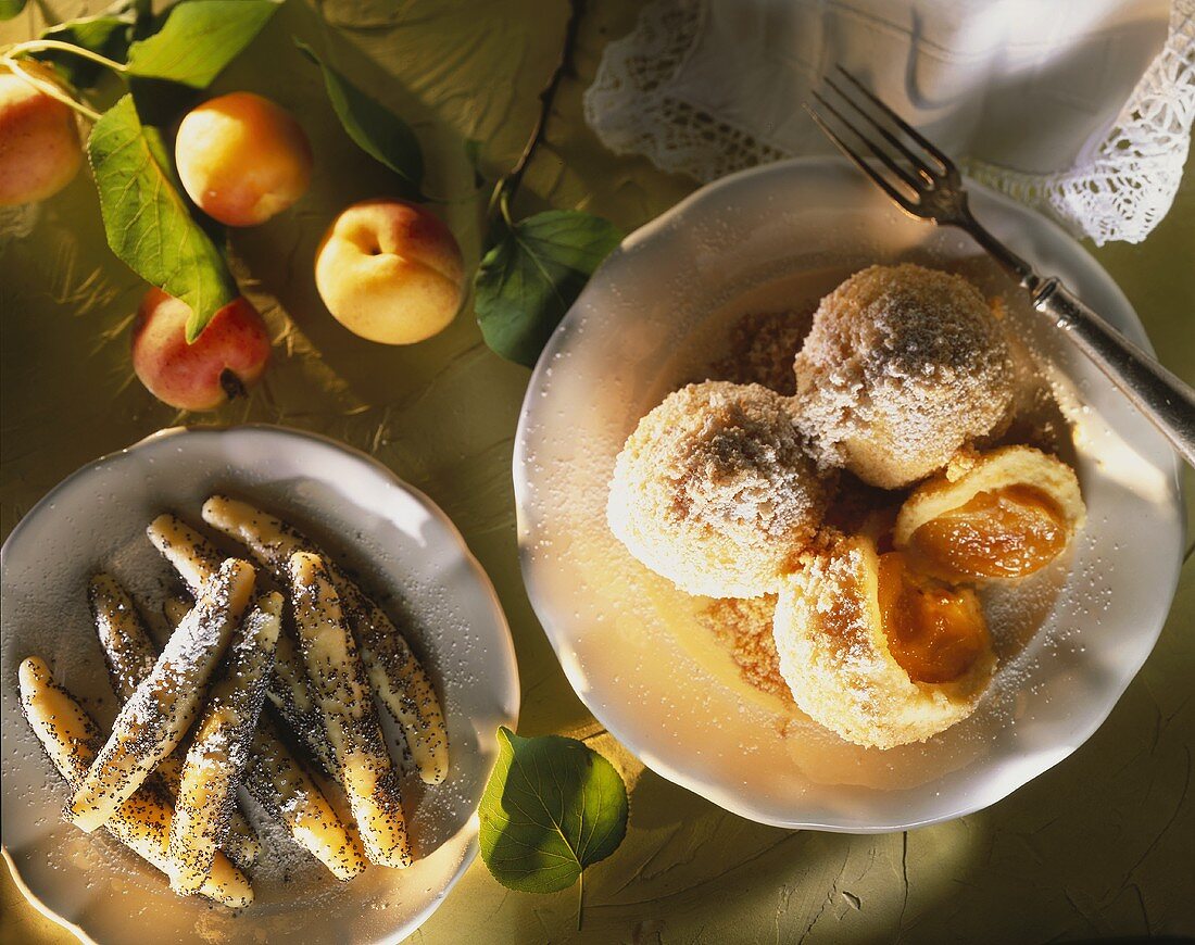 Apricot dumplings & poppy seed noodles with icing sugar