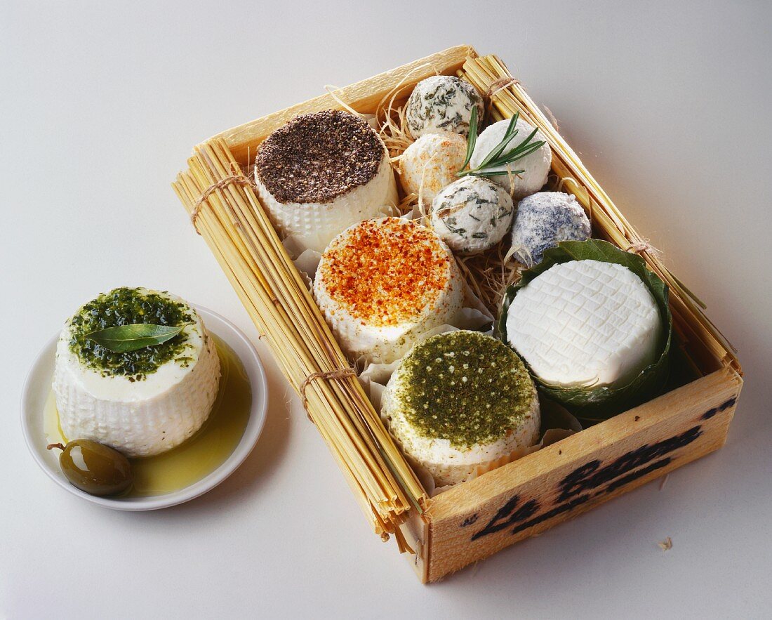 Sheep's cheese with herbs and spices in wooden box