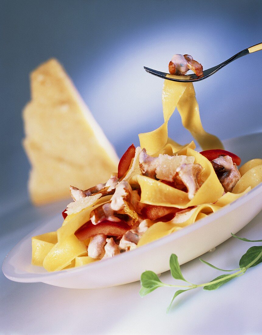 Tagliatelle with chanterelles, tomatoes and pecorino