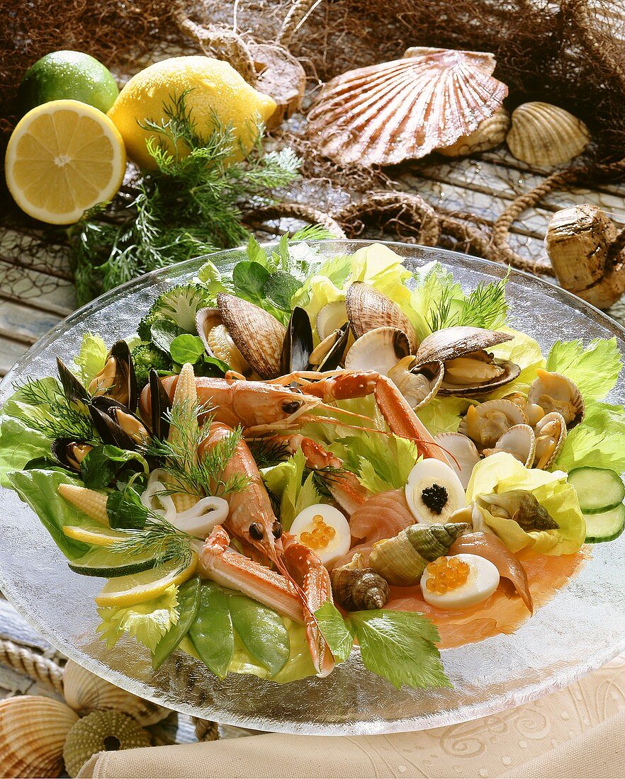 Seafood platter with egg, caviare, vegetables and salad