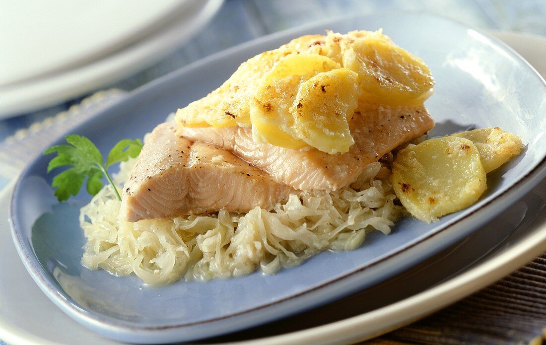 Sauerkraut casserole with salmon trout and potatoes
