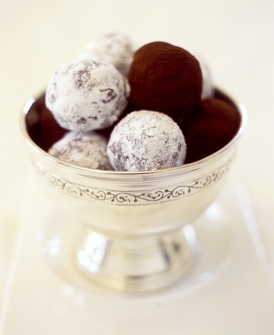 Marzipan balls with icing sugar and cocoa powder