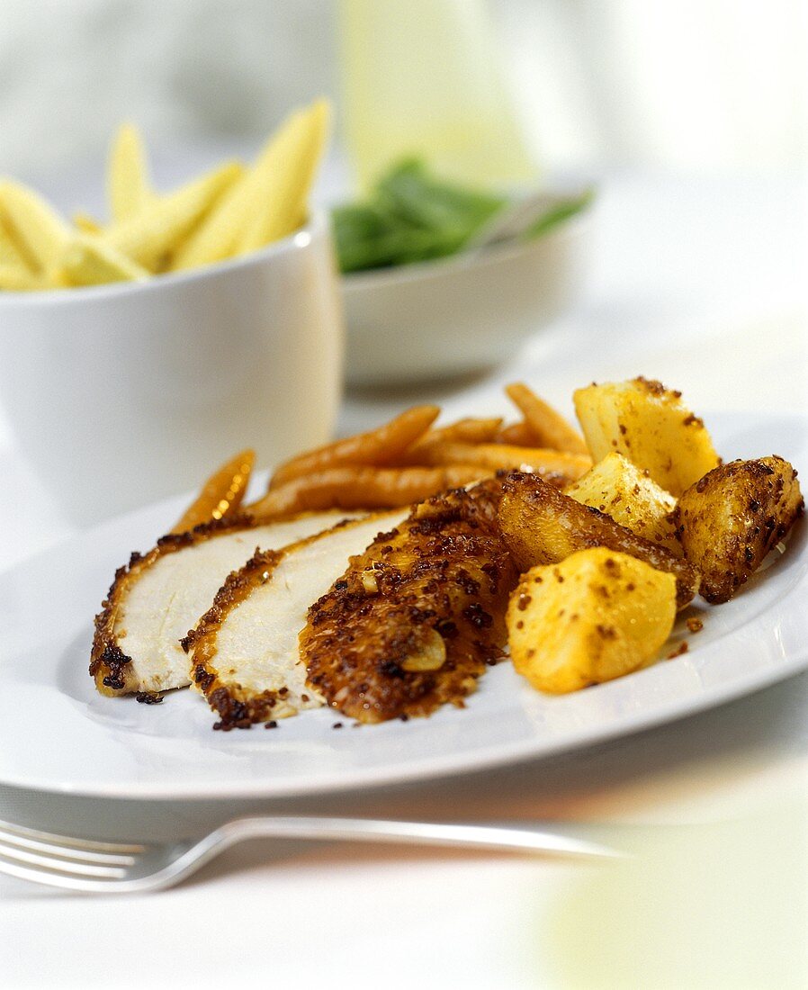Chicken breast with mustard crust and potatoes