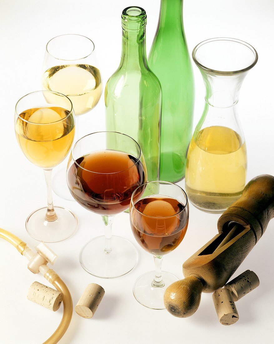 Various wine glasses and wine bottling equipment