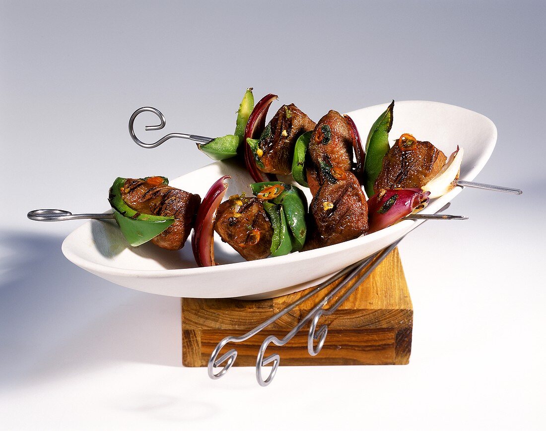 Spicy lamb kebabs with peppers and onions