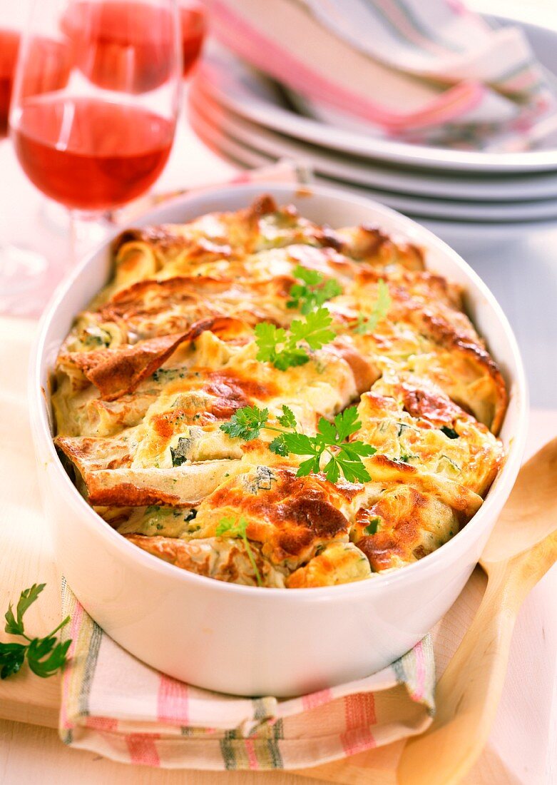 Pancakes with vegetables in baking dish