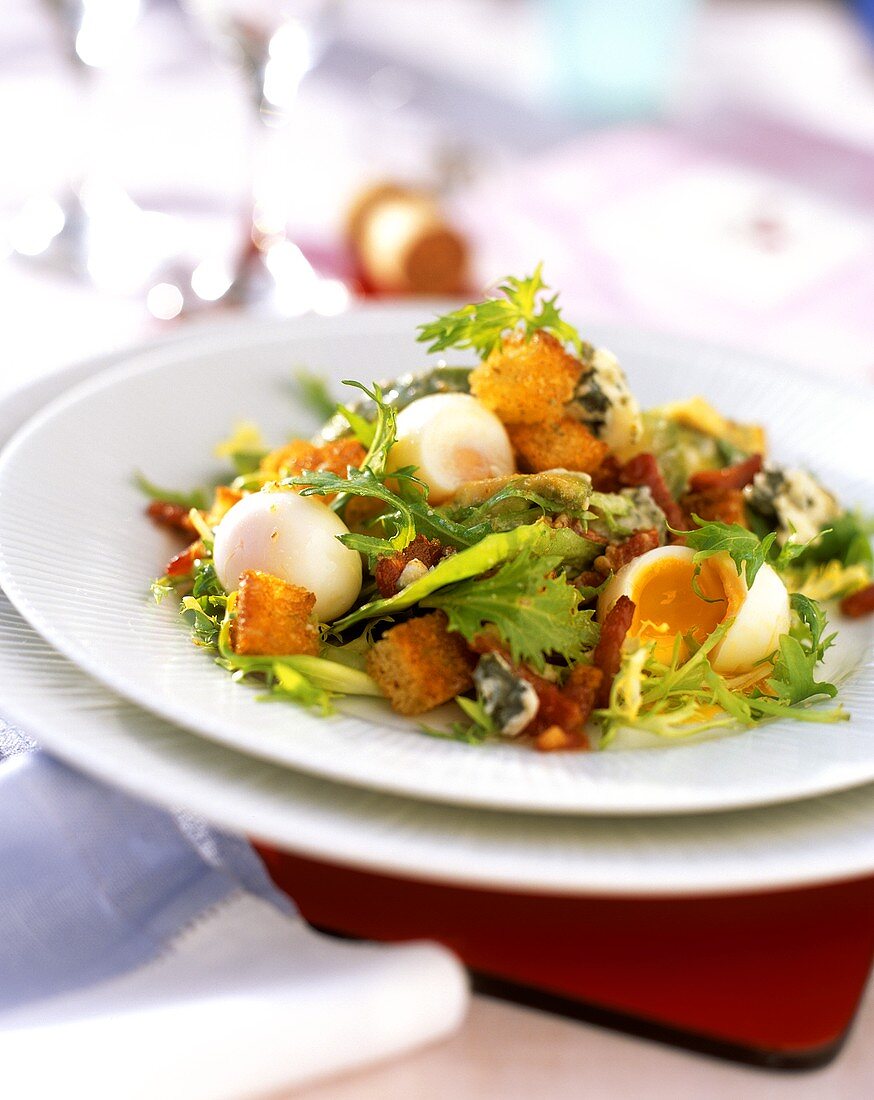Winter salad with quail's eggs and croutons