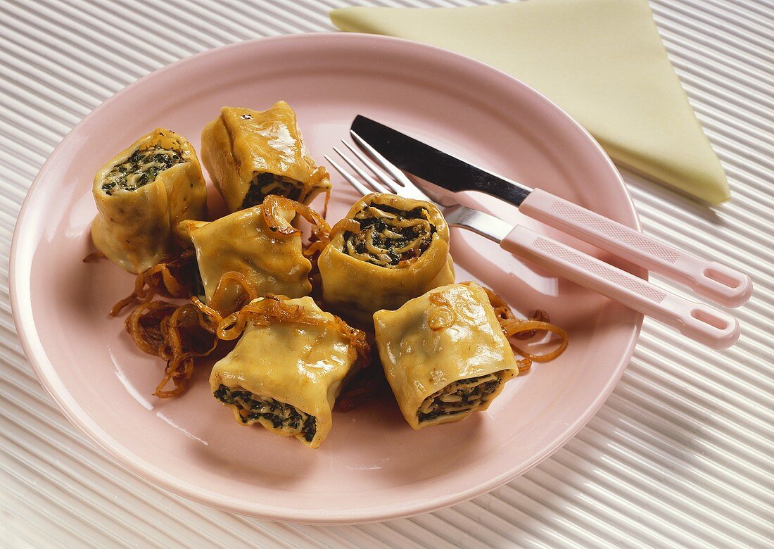 Rolled pasta parcels with mince and spinach filling