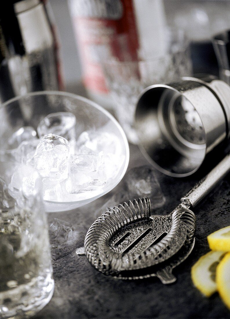 Ice cubes and bar utensils for making cocktails