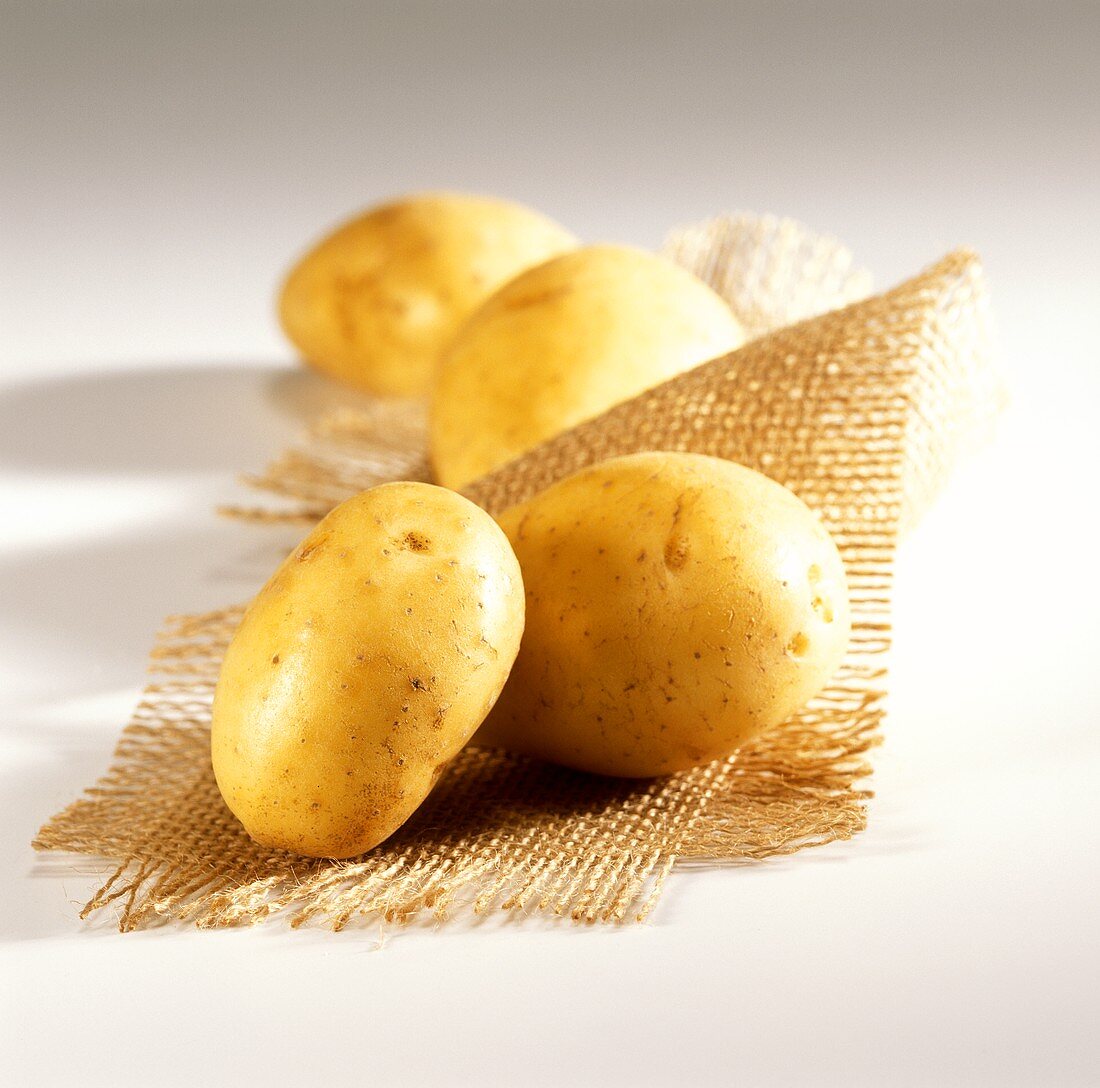 New potatoes on jute