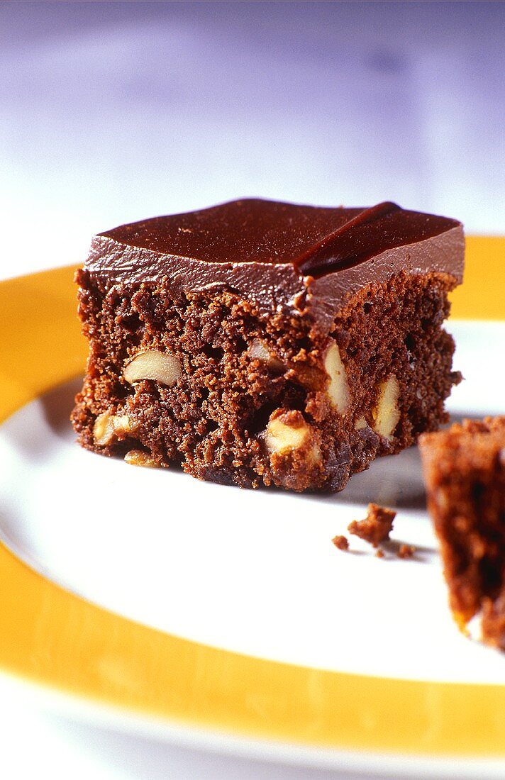 Chocolate squares with nuts on plate