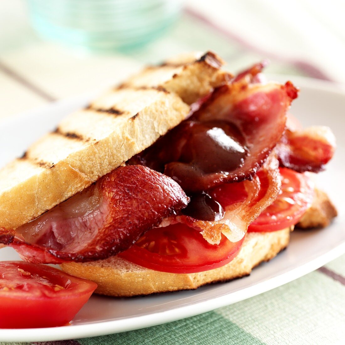 Toasted sandwich with bacon and tomatoes