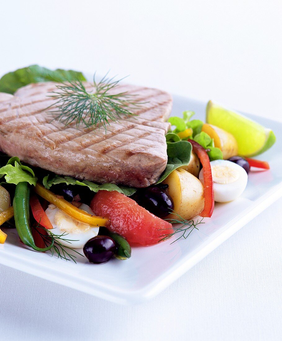Tuna steak on vegetable salad