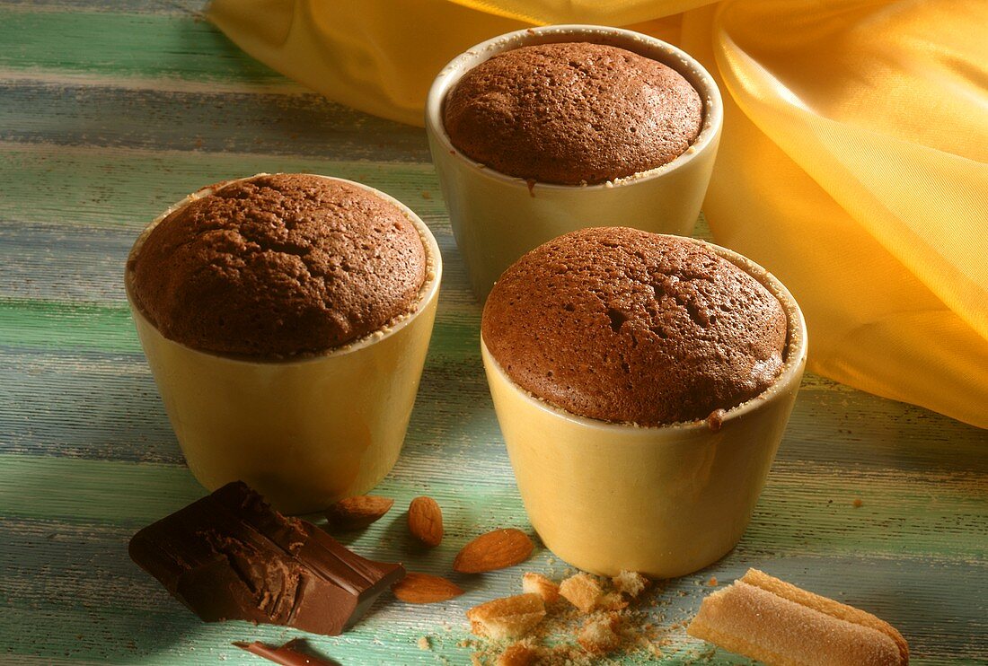 Small chocolate soufflés in yellow moulds