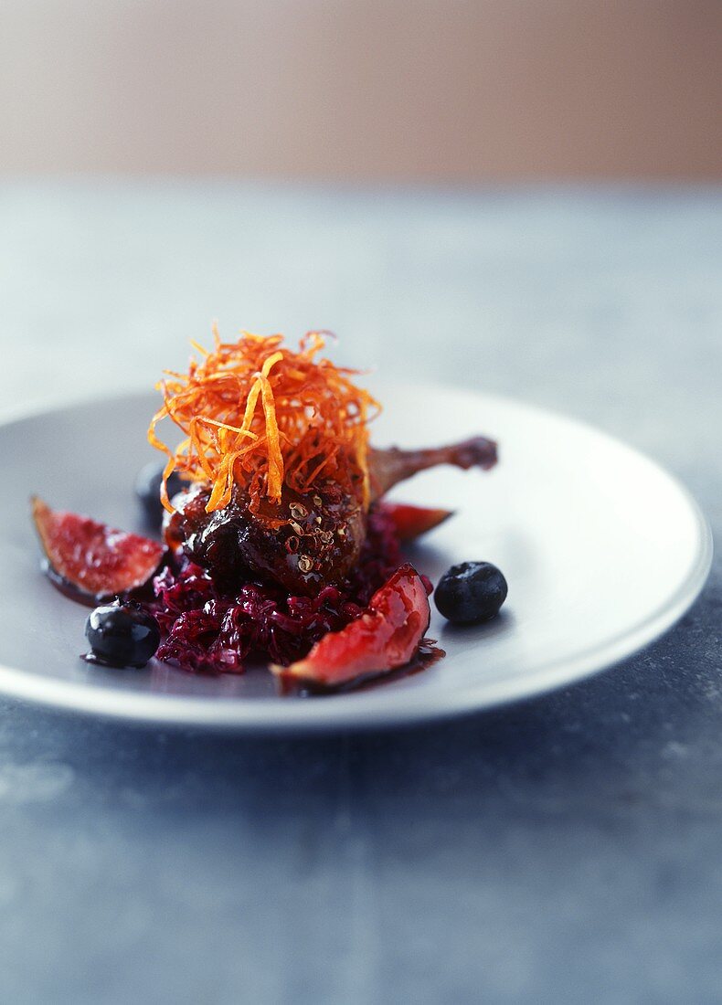 Glazed duck leg with red cabbage and figs