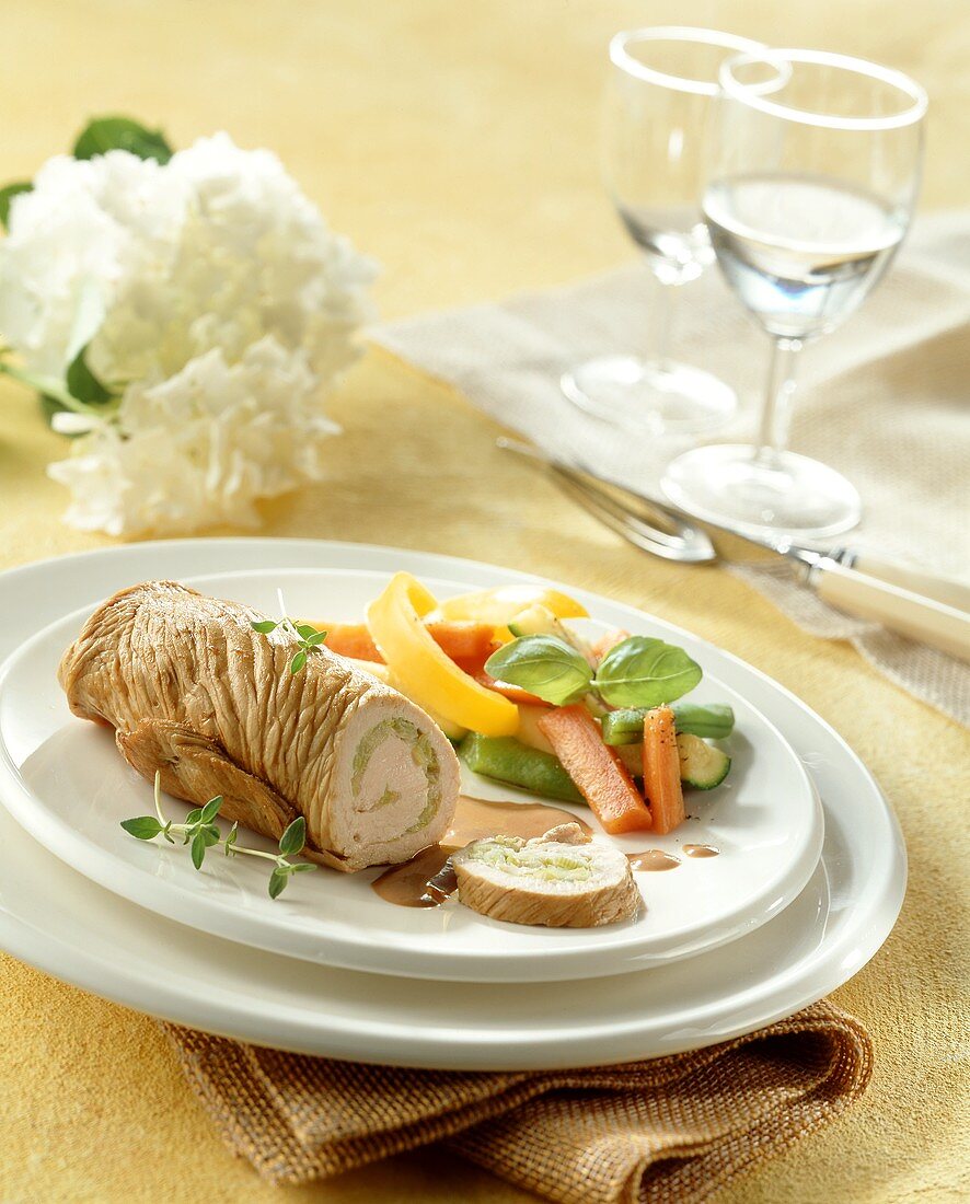 Turkey roulade with leek filling and vegetables