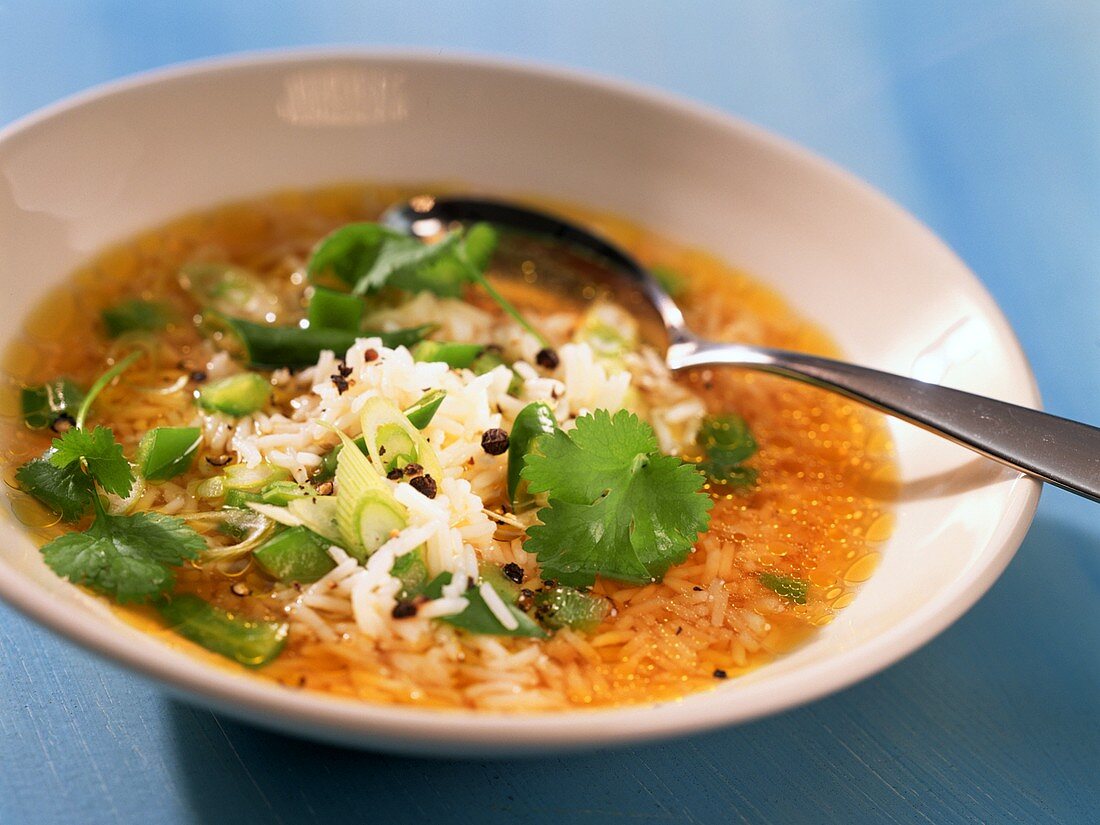 Asian rice soup with mangetout peas and coriander