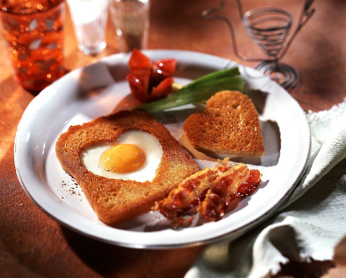 Toast heart with fried egg and bacon