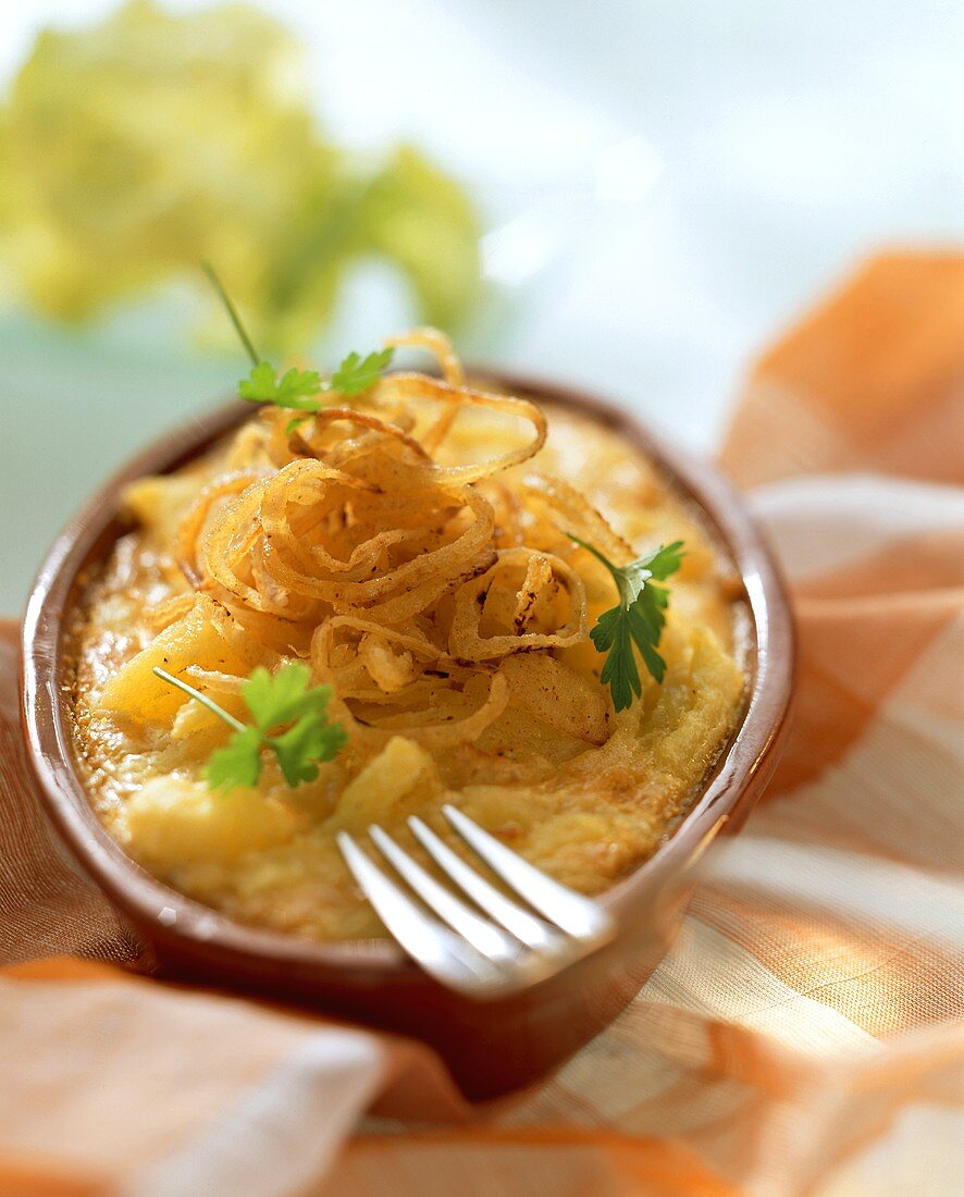 Cheese noodles (spaetzle) with fried onions and parsley