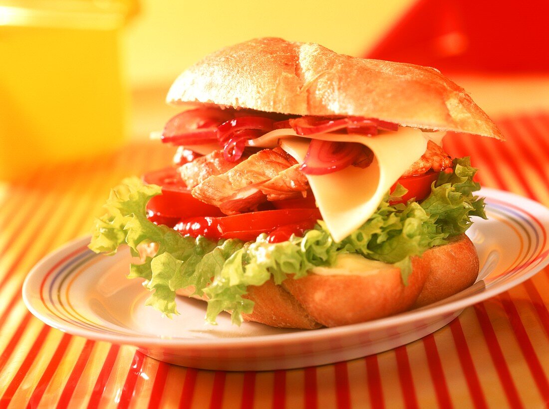 Turkey sandwich with cheese, tomatoes and lettuce