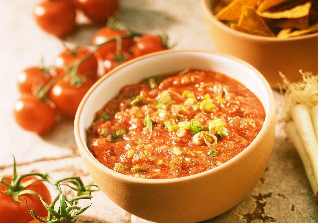 Cooked tomato salsa with spring onions