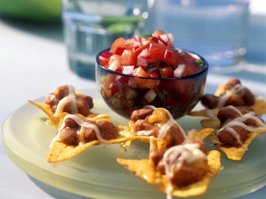Baked nachos with beans and tomato salsa