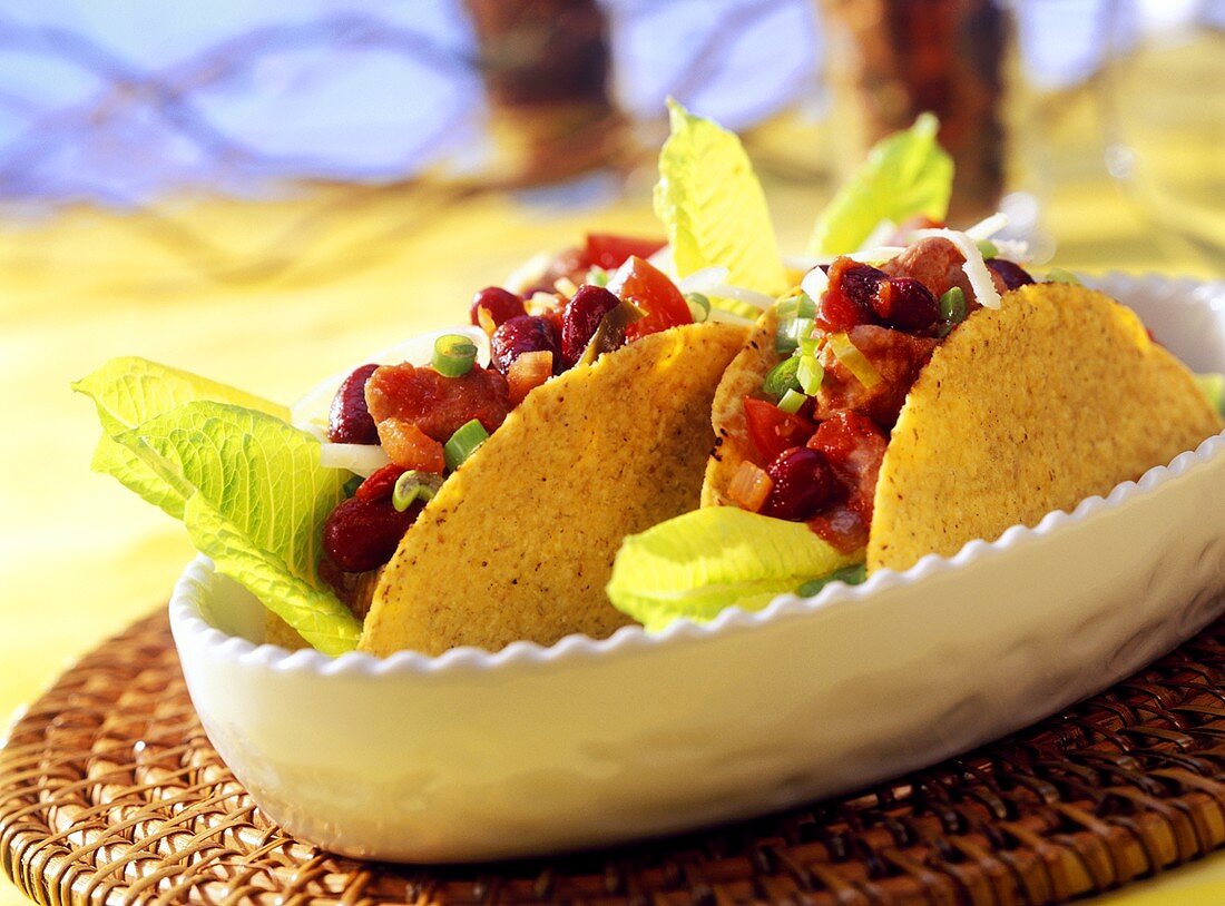 Taco shells with chicken filling and romaine lettuce