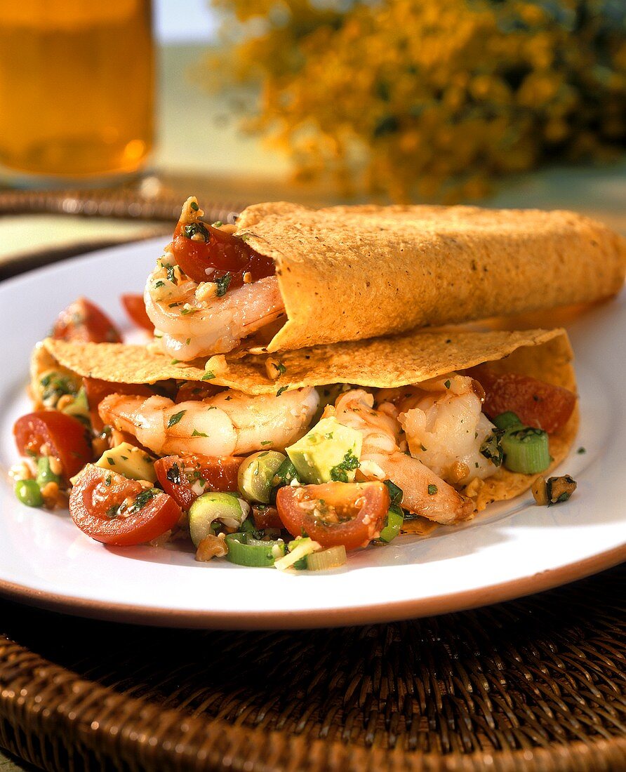 Taco shells with coriander shrimps & tomato & avocado salad