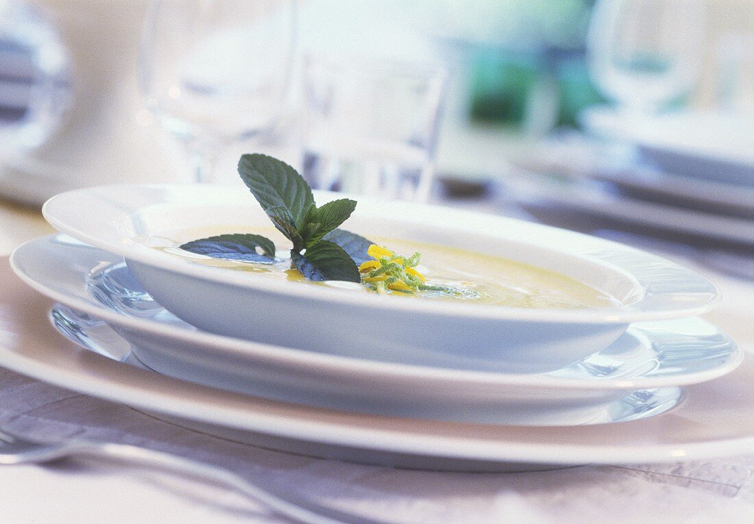 Cream soup with mint and lime zest